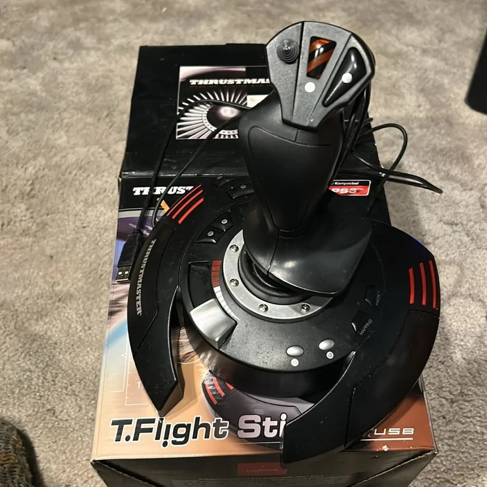 This is a T Flight Stick X. It comes in its original box with 2 additional discs